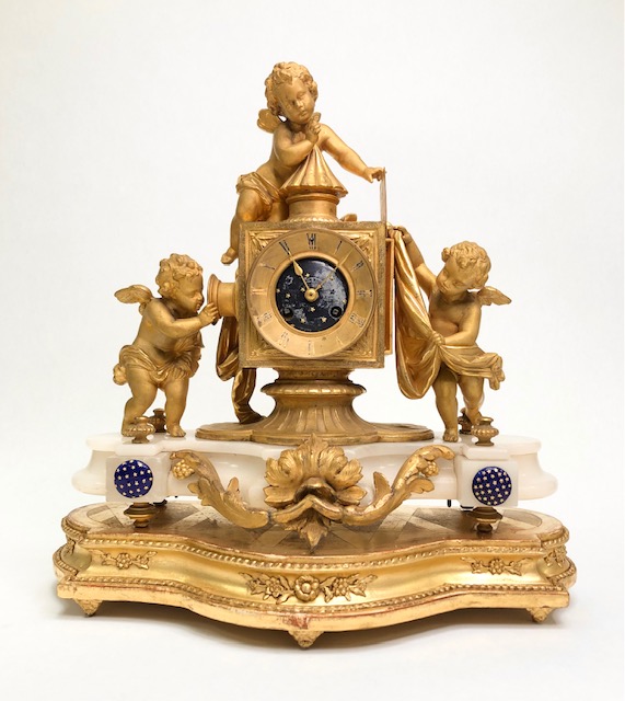 Pendule Lanterne magique en régul doré 1850